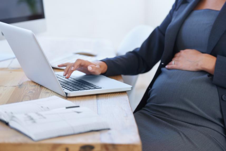Pregnant mom working from desk