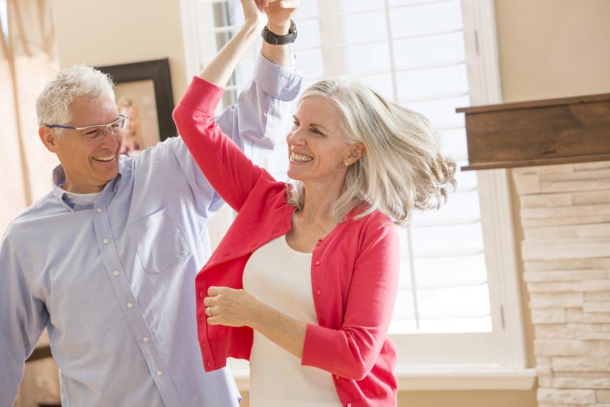 Photo: Mature couple smiling and dancing