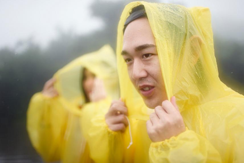 Man in a yellow rain slicker.