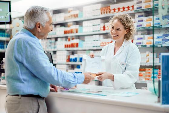 A man getting a prescription from the pharmacy