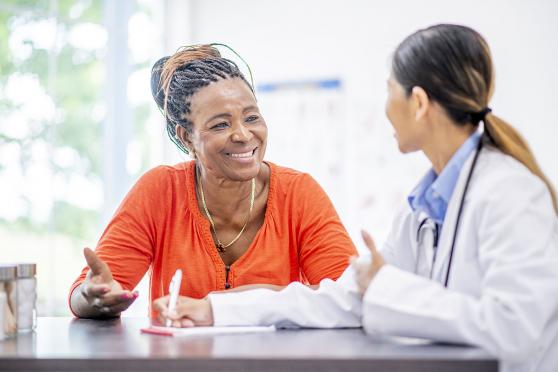 Doctor and patient talking, smiling