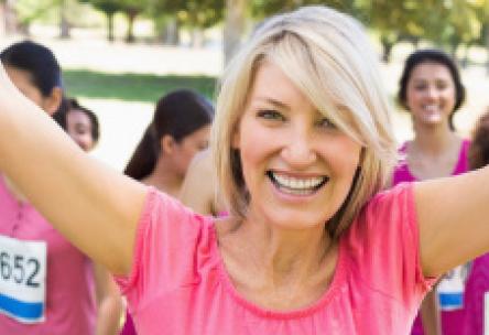 Photo: Happy women in pink t-shirts at running race