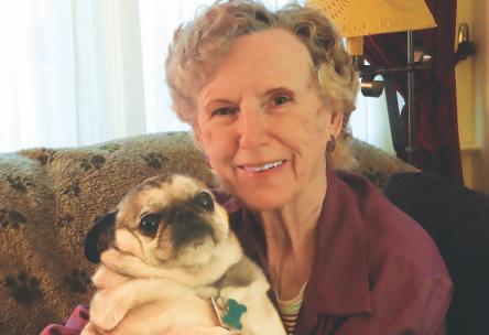 women holding dog