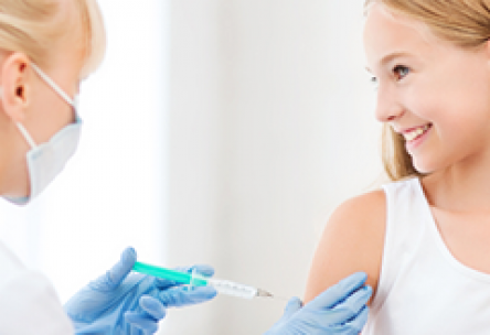 Doctor gives teen a vaccine shot