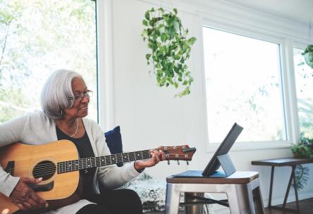 woman playing guitar