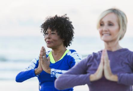 older women doing yoga