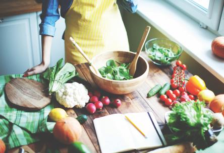 Woman standing over locally grown vegetables