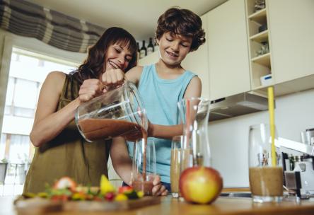 mom and child making smoothie