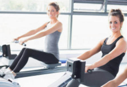 Photo: 3 women on rowing machines in a gym